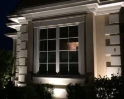Beautifully lit residential home showcases outdoor lighting for aesthetic appeal and safety in the Hilton Head area of coastal SC. Outdoor house lighting enhances curb appeal and security with well-placed fixtures in the Hilton Head coastal area.